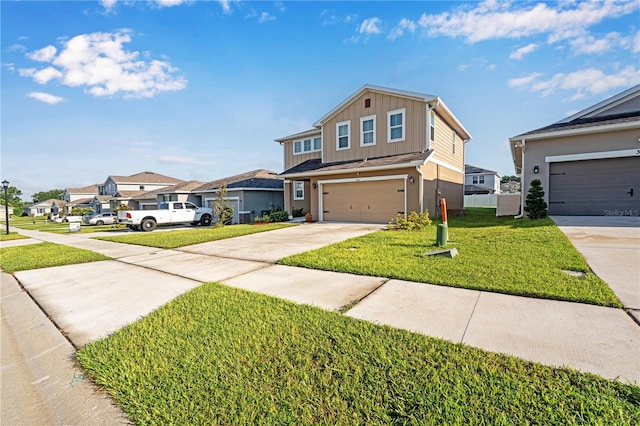 view of front property with a garage and a front yard