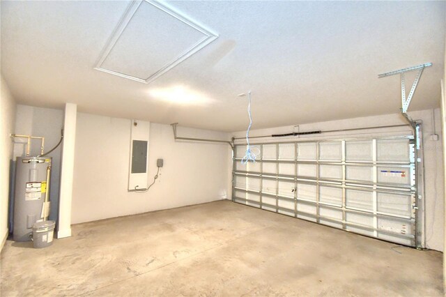 garage featuring electric water heater and electric panel