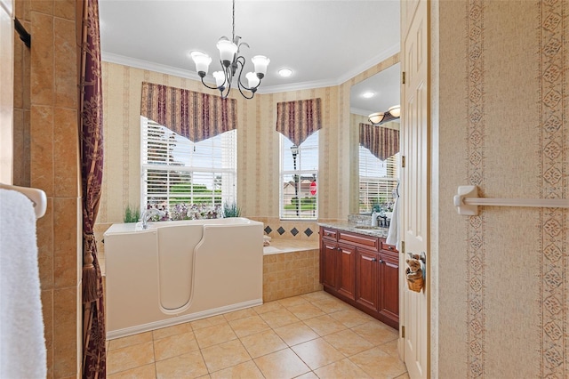 bathroom featuring tile patterned flooring, vanity, ornamental molding, tiled bath, and a chandelier