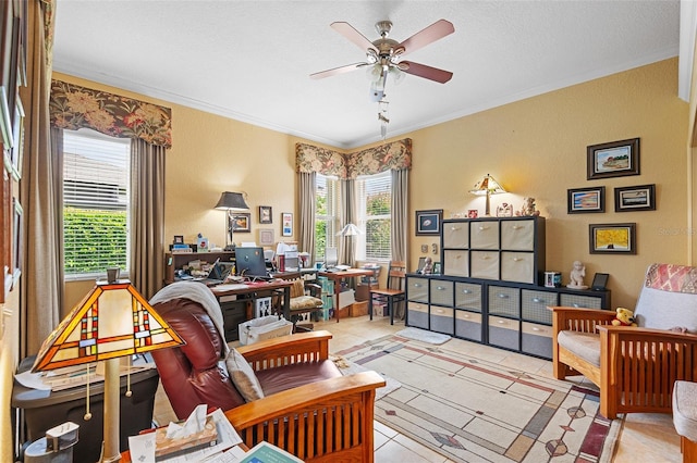 sitting room featuring light tile patterned floors, a textured ceiling, ornamental molding, and ceiling fan