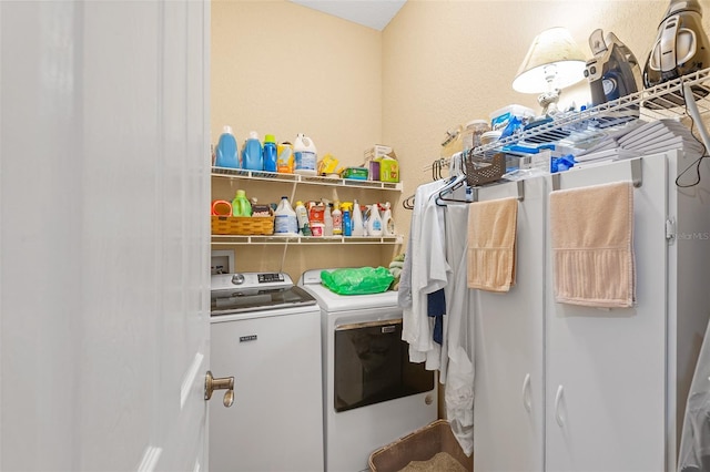 washroom featuring independent washer and dryer