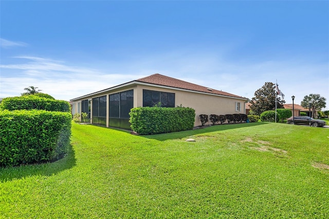 view of home's exterior featuring a yard