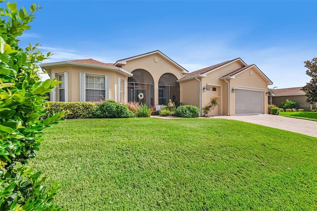 view of front of home featuring a garage and a front lawn