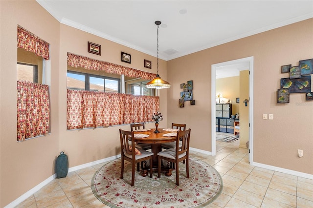 tiled dining space featuring ornamental molding