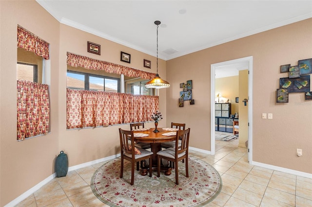 4496 Strathmore Dr, Lake Wales, FL 33859 - dining room featuring light tile patterned floors, crown molding, and baseboards