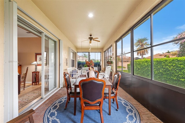 4496 Strathmore Dr, Lake Wales, FL 33859 - sunroom / solarium with brick floors, ceiling fan, outdoor dining area, and recessed lighting