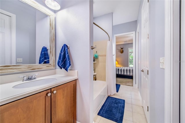 bathroom with bathing tub / shower combination, tile patterned floors, and vanity