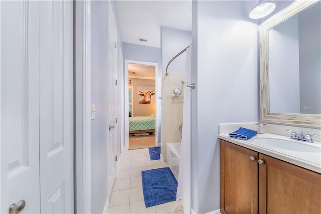 full bath with ensuite bath, shower / tub combination, tile patterned flooring, and vanity