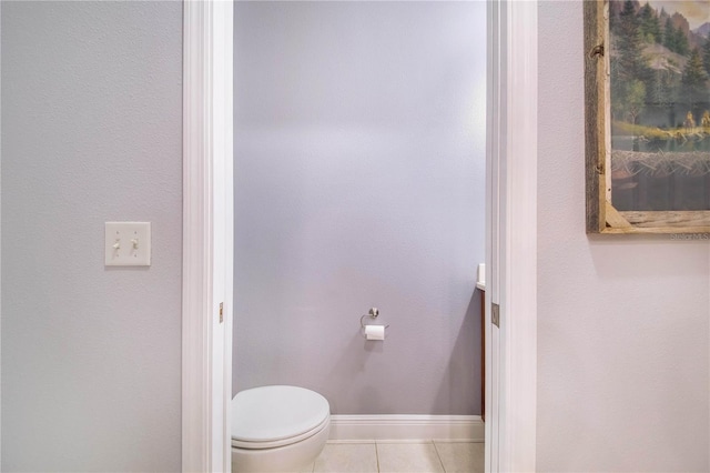 bathroom featuring toilet and tile patterned floors