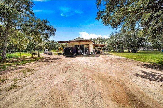 view of front of property featuring a carport