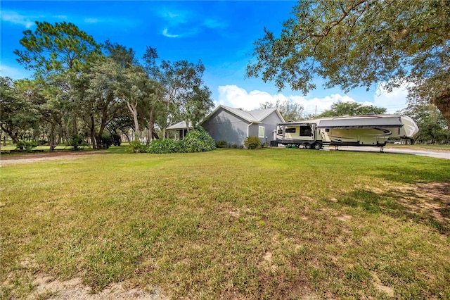 view of front facade featuring a carport and a front lawn