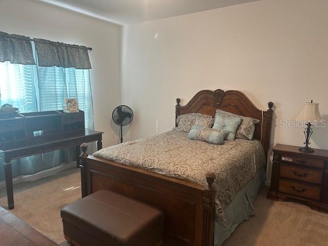 bedroom with light colored carpet