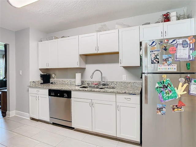 kitchen featuring sink, white cabinets, and appliances with stainless steel finishes