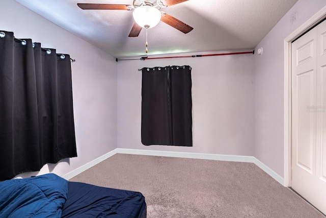 bedroom featuring ceiling fan and carpet flooring