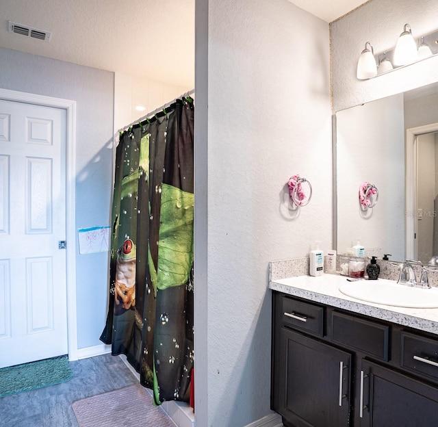 bathroom featuring vanity and tile patterned floors