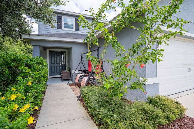 entrance to property featuring a garage