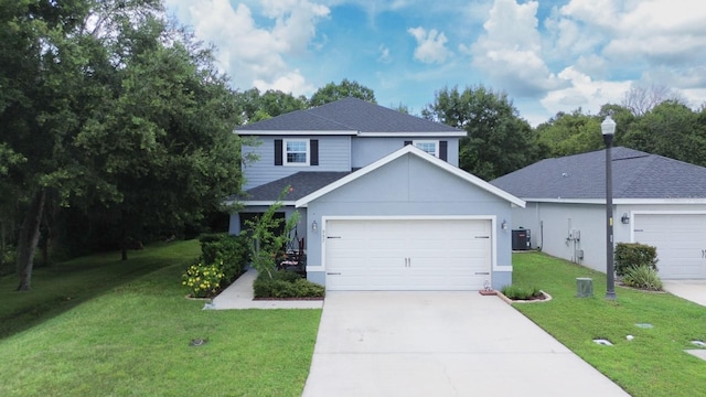 view of front of home with a garage and a front lawn