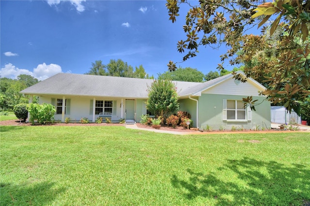 ranch-style house featuring a front lawn