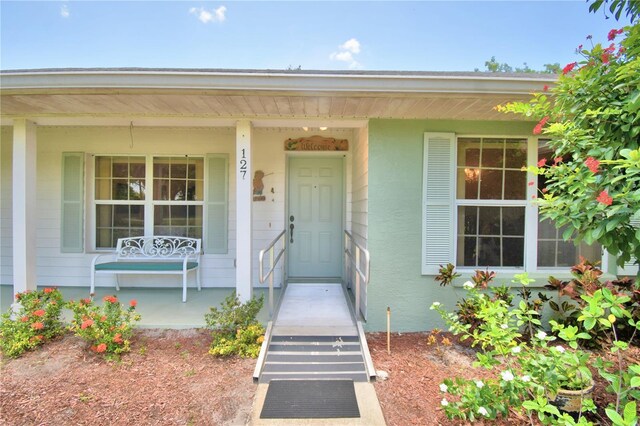 property entrance with a porch