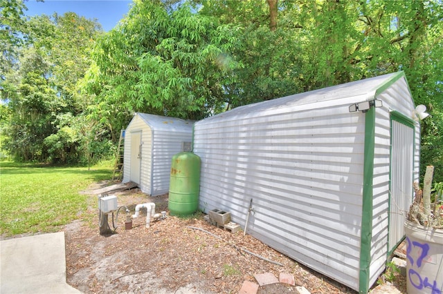 view of outbuilding featuring a yard