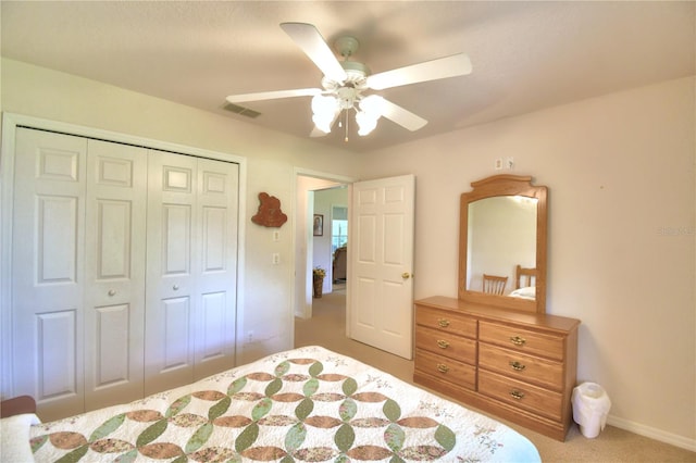 bedroom with carpet, a closet, and ceiling fan