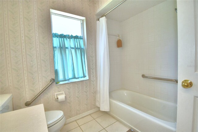 bathroom featuring shower / bath combo, tile patterned floors, and toilet