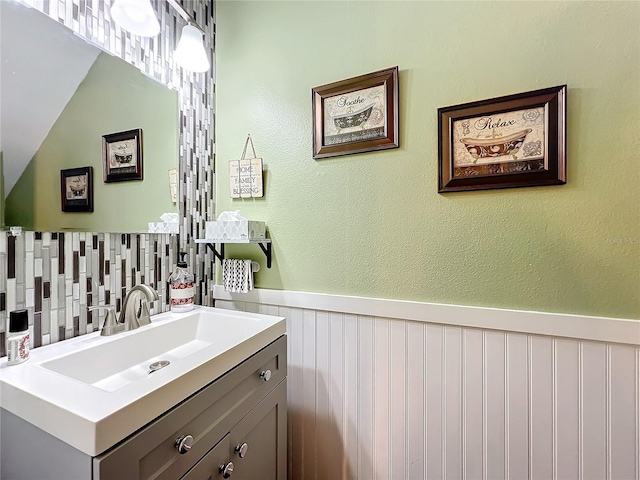 bathroom with vanity and vaulted ceiling