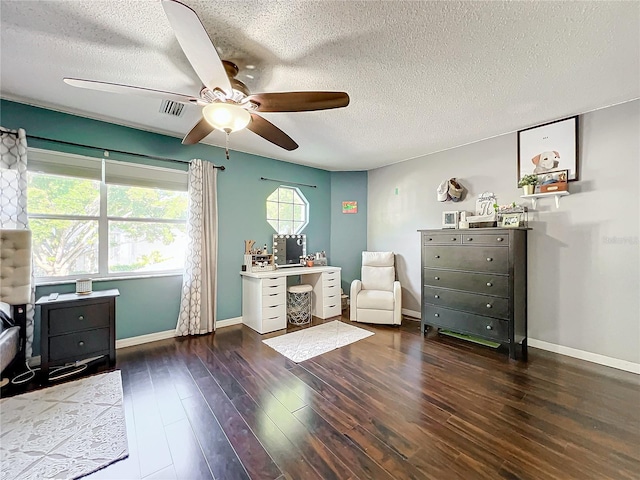 interior space with a textured ceiling, ceiling fan, and dark hardwood / wood-style floors