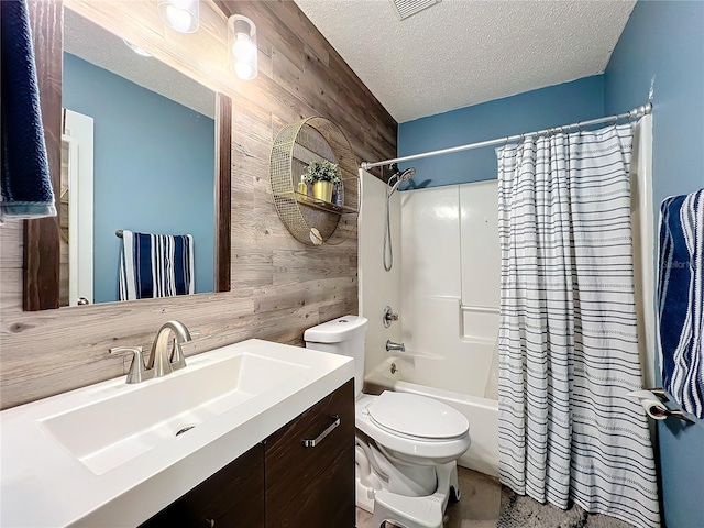 full bathroom featuring shower / bath combination with curtain, wood walls, toilet, and a textured ceiling