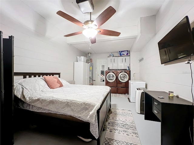 bedroom featuring ceiling fan and wooden walls