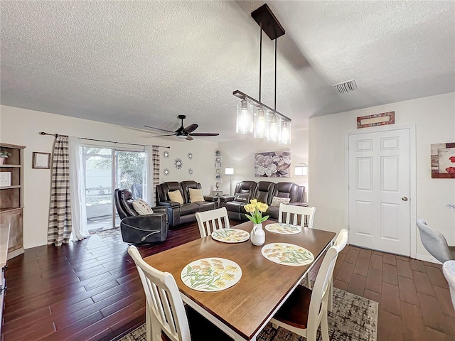 dining space featuring ceiling fan and a textured ceiling