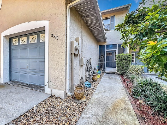 doorway to property featuring a garage