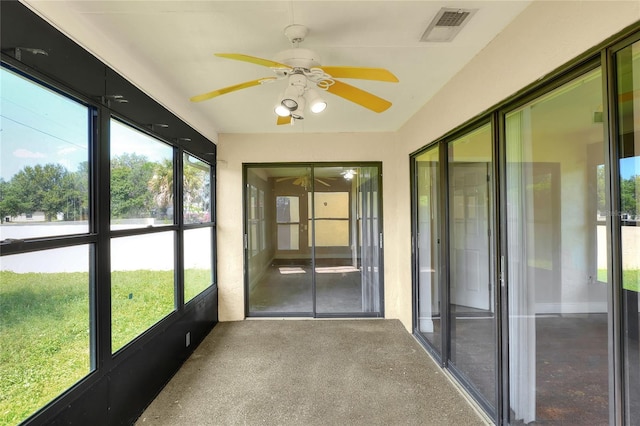 unfurnished sunroom featuring visible vents