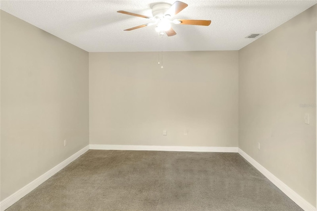 unfurnished room with a textured ceiling, ceiling fan, carpet floors, visible vents, and baseboards