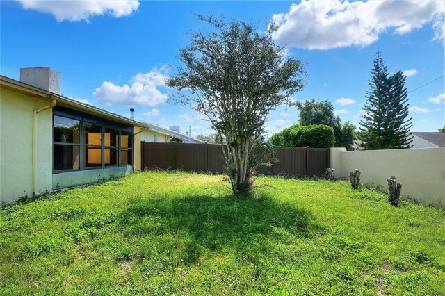 view of yard with a fenced backyard