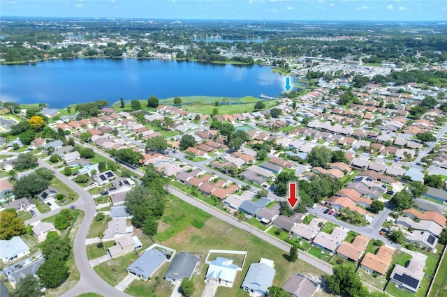 birds eye view of property featuring a water view and a residential view