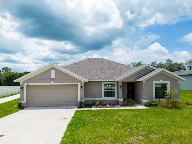 ranch-style house with a front yard and a garage