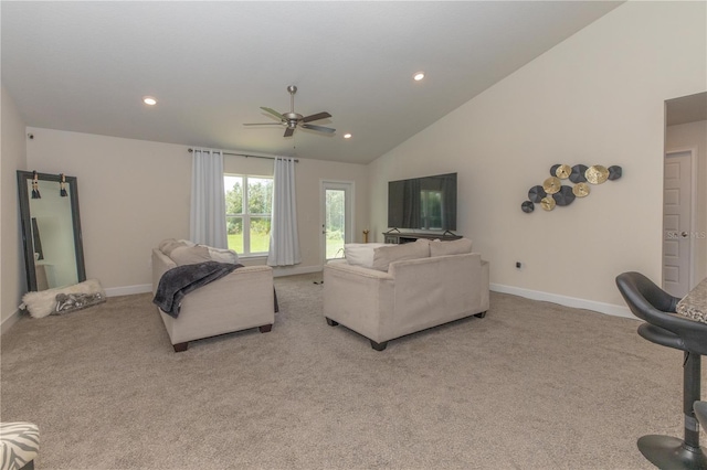 living room featuring ceiling fan, high vaulted ceiling, and light colored carpet