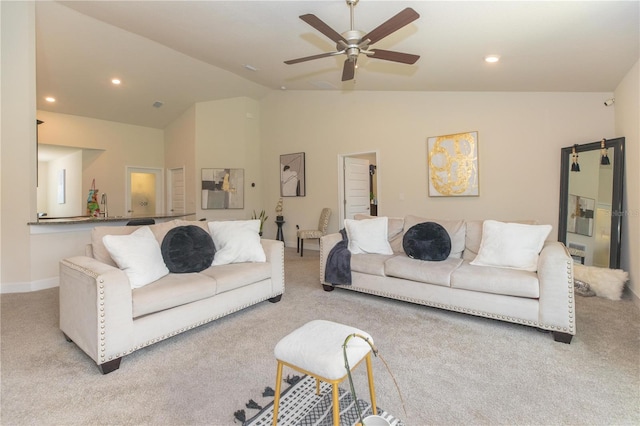 living room with ceiling fan, high vaulted ceiling, and light colored carpet