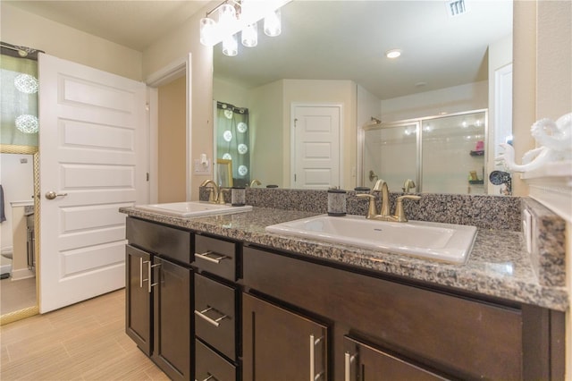 bathroom with dual vanity and tile patterned flooring