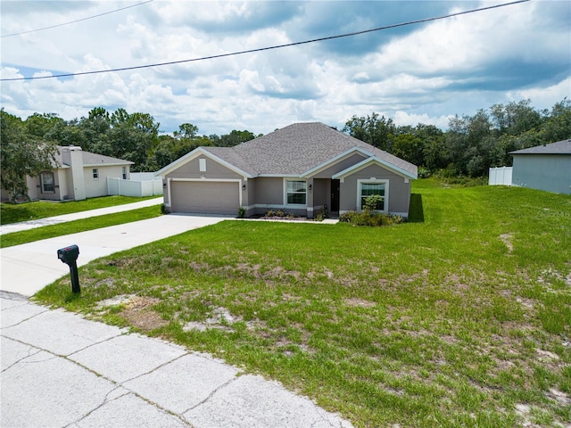 ranch-style house with a front yard and a garage