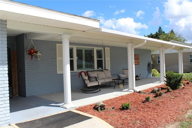 view of patio featuring a porch