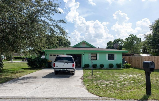 ranch-style house with a garage and a front yard