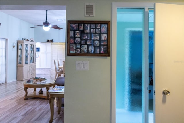 corridor featuring light hardwood / wood-style flooring