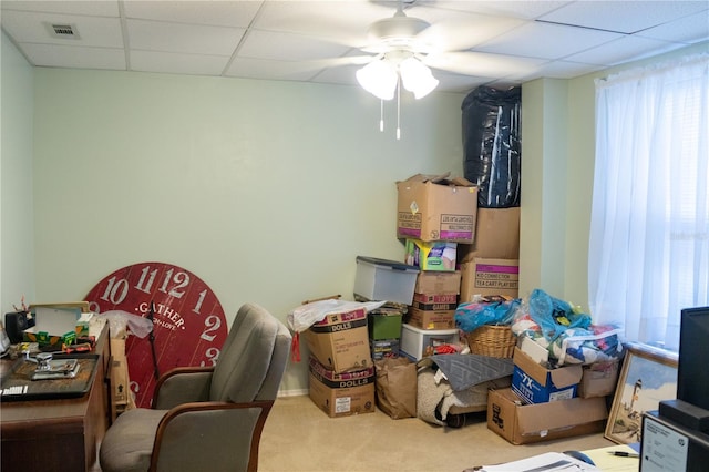 interior space with ceiling fan