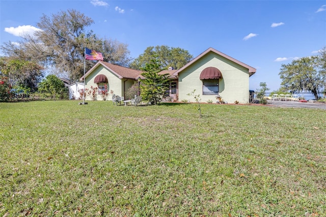 ranch-style home with a front yard