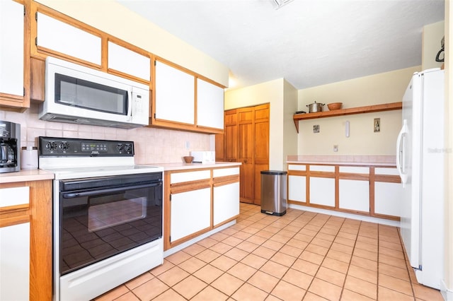 kitchen featuring white appliances, white cabinets, light countertops, open shelves, and tasteful backsplash