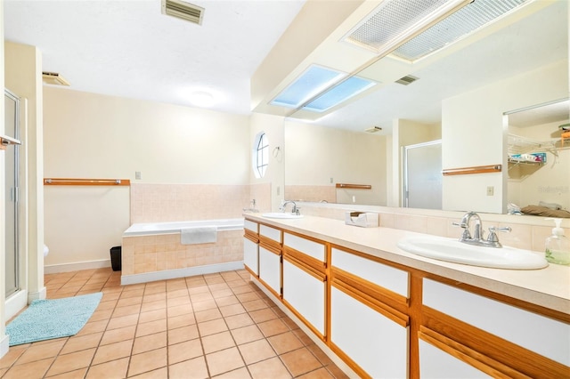 bathroom featuring tile patterned flooring, a sink, visible vents, double vanity, and a stall shower