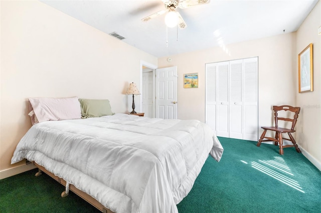 carpeted bedroom with a ceiling fan, a closet, visible vents, and baseboards