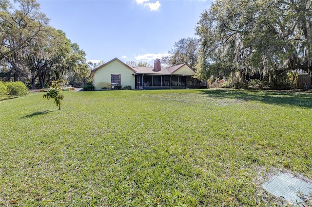 view of yard featuring a sunroom